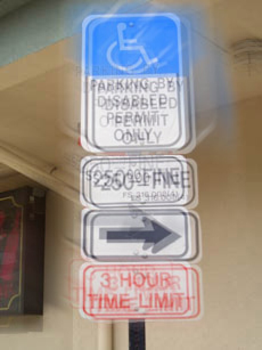 A simulation of what street signs look like to someone with keratoconus.