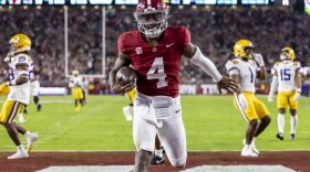 Alabama quarterback Jalen Milroe scores a running touchdown against LSU during the first half of an NCAA college football game, Saturday, Nov. 4, 2023, in Tuscaloosa, Ala. (AP Photo/Vasha Hunt)