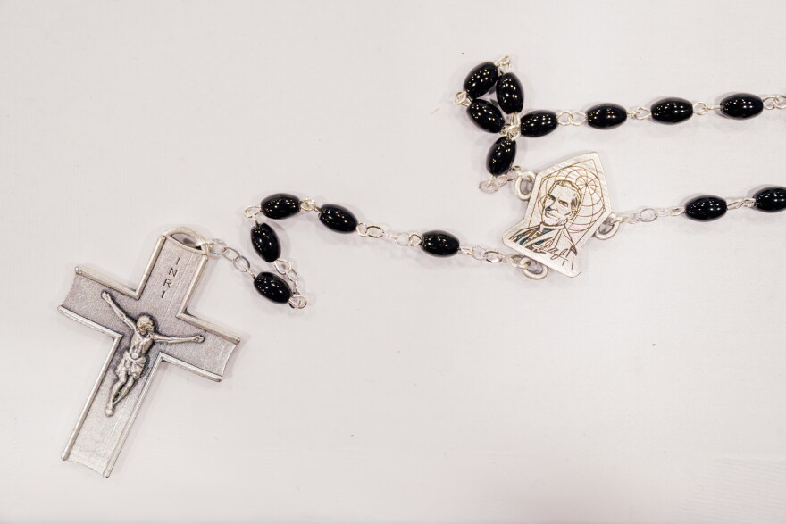 A rosary featuring an image of the late Archbishop Fulton J. Sheen is displayed ahead of his beatification Mass on Thursday.