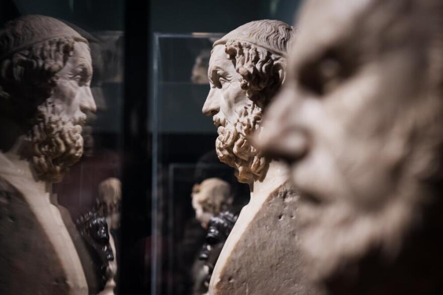 Marble busts of philosophers Homer (C, 1-2 century AD) and Chrysippos (R, 1st century AD) are displayed. (Leon Neal/AFP via Getty Images)