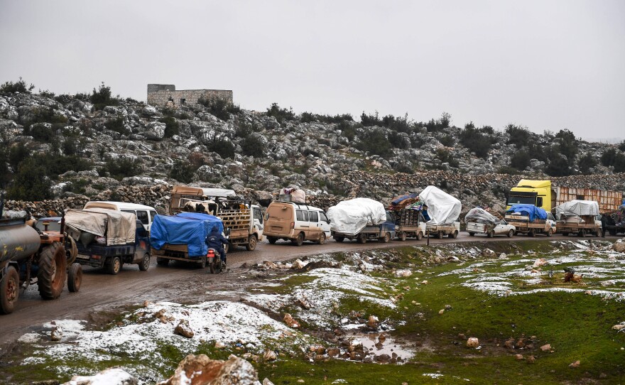 Syrian civilians flee from Idlib, seeking safety from the fighting that began escalating in December.