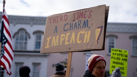 Protestors in Chardon, Ohio hold signs at a 'No Kings' rally
