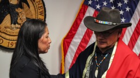 Secretary of the New Mexico Indian Affairs Department Lynn Trujillo (Left) speaks with Chaplain Jose L. Villegas Sr. (Right)