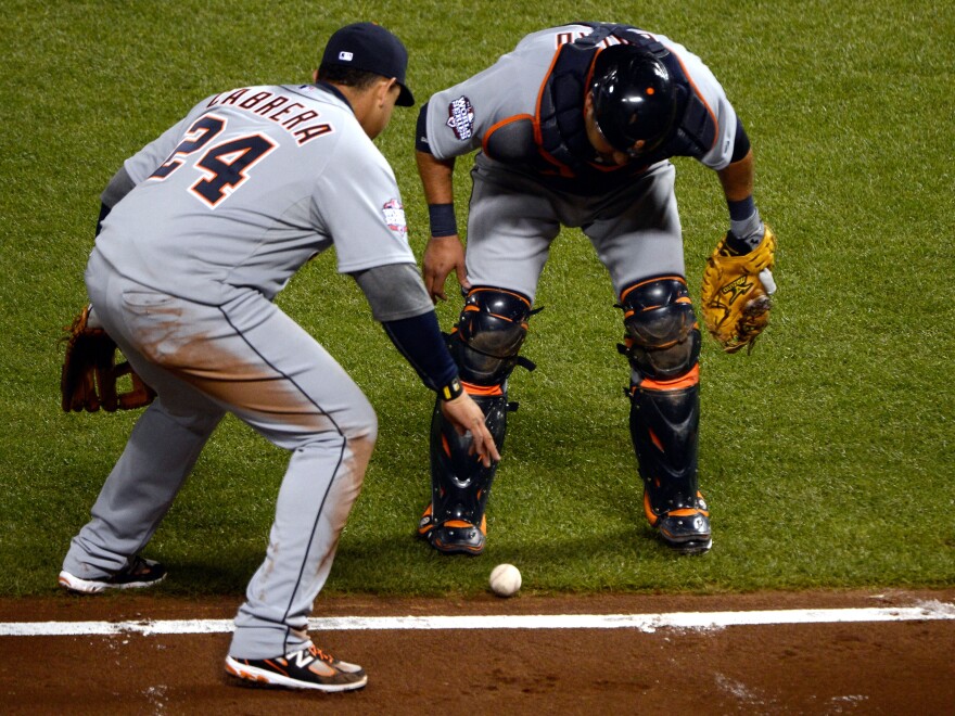 Please go foul, please go foul, please go foul: Third-baseman Miguel Cabrera (No. 24) and catcher Gerald Laird of the Detroit Tigers watched closely to see if a bunt by the Giants' Gregor Blanco would go foul Thursday night in San Francisco. It didn't. The Giants scored and went on to win the game and take a 2-0 lead in the World Series.