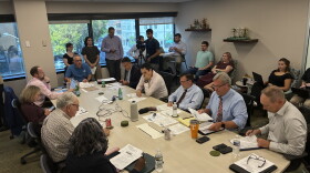 Reporters and data center opponents watch as the Western Virginia Regional Industrial Facility Authority meets.