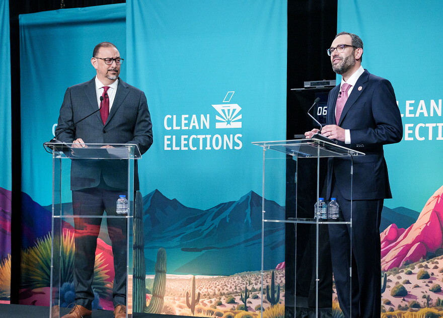 Democrat Secretary of State Adrian Fontes, left, argues Wednesday night with Republican challenger Alexander Kolodin.