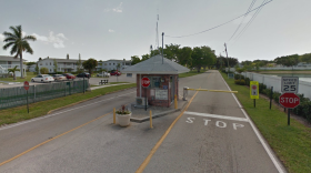 The security kiosk at the entrance to Century Village, a gated community that is now home to a public polling station.