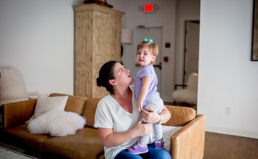 Shannon White holds her daughter, Stella. White's path to CEO was an unconventional one. She left college before getting her degree, then joined a Besh restaurant as a server, then manager.