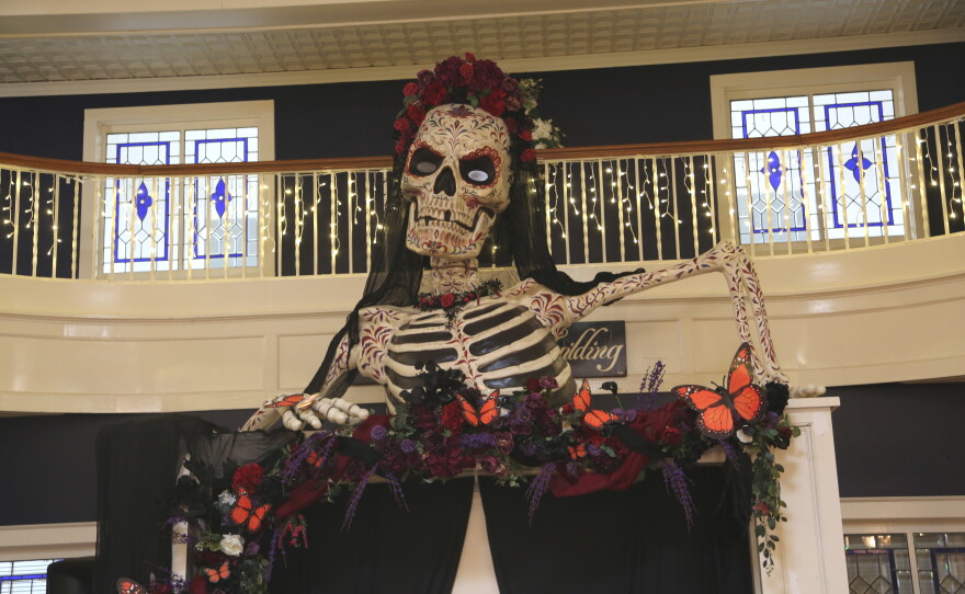La Catrina overlooking the dance floor for the Día de Muertos Masquerade Ball, painted by local artist Jerry Foote.