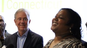 Governor Ned Lamont (D) watches as Miss Smith, who recently had her record erased, speaks. "Clean Slate just didn't clear my record," Smith said. "It gave me back my dignity. It gave me back my future.”