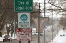 Traffic moves along Monroe Avenue in Brighton, N.Y., where the state Department of Transportation has proposed a resurfacing project that would reconfigure much of the corridor, add improved crosswalks, and potentially lower the speed limit to improve safety for drivers, pedestrians and cyclists.