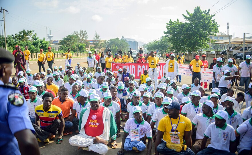 Sani Muntari, front row in yellow shirt, didn't let polio stop him. He's a teacher, a father and a soccer player.