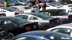 People shop for cars in Los Angeles in 2009. Brand new cars are not the most attractive to car thieves, though. The most-stolen vehicle in 2009 was the 1994 Honda Accord.