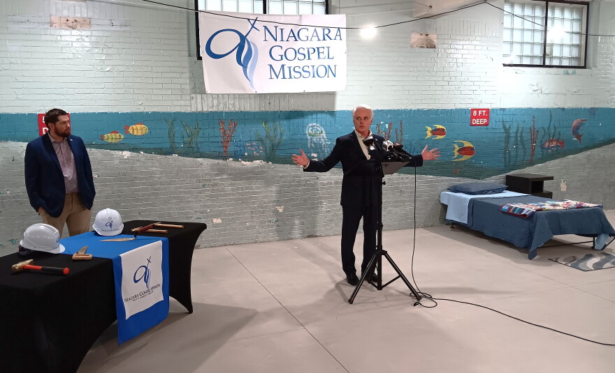 Niagara Falls Mayor Robert Restaino speaks during a ceremony marking construction of a future emergency shelter for women within Niagara Gospel Mission. The recently constructed floor covers what used to be the swimming pool in a building previous occupied by the YMCA.