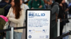 A sign posted at the United Airlines terminal reads: "Are you REAL ID ready ?" while holiday travelers line up to clear security as they depart Los Angeles International Airport, in Los Angeles, Wednesday, Nov. 26, 2025.