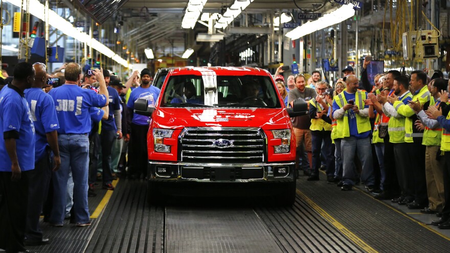 A 2015 F-150 rolls off the assembly line at the Dearborn Truck Plant in Dearborn, Mich. The aluminum-sided F-150 could set a new industry standard — or cost the company its pickup truck crown.