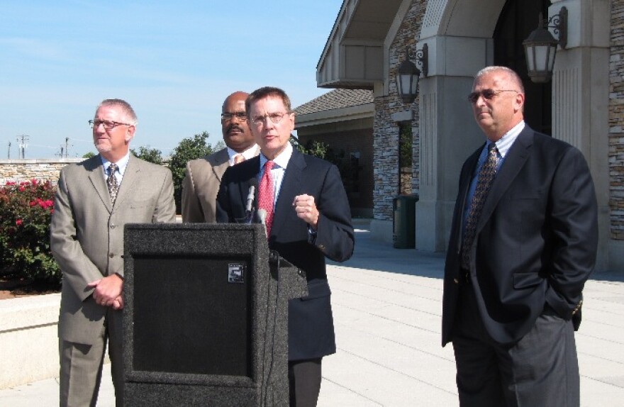 Lexington Mayor Jim Gray announces Ray Sabbatine (right) as interim director of Community Corrections. Also pictured are Public Safety Commissioner Clay Mason (far left) and Senior Advisor Glenn Brown
