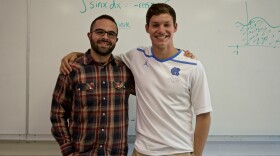 Picture of student Jackson and teacher Myles in a math classroom.