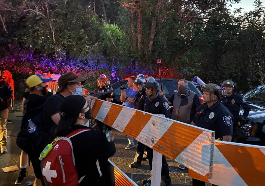 Protesters in front of a police barricade in Springfield on July 29, 2020.