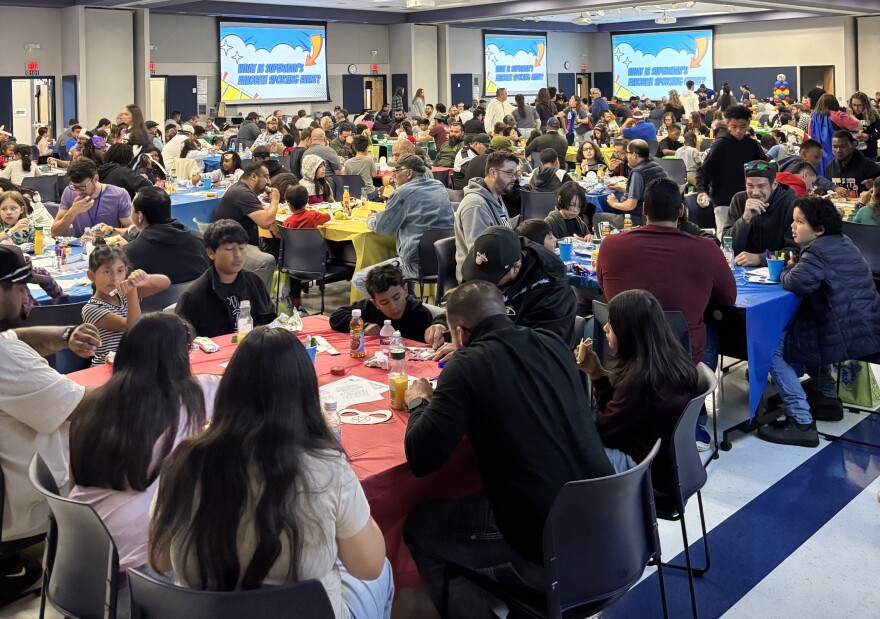 Strong Father/Child Saturday from Northside ISD. Fathers and their children enjoy breakfast together before the day's activities.