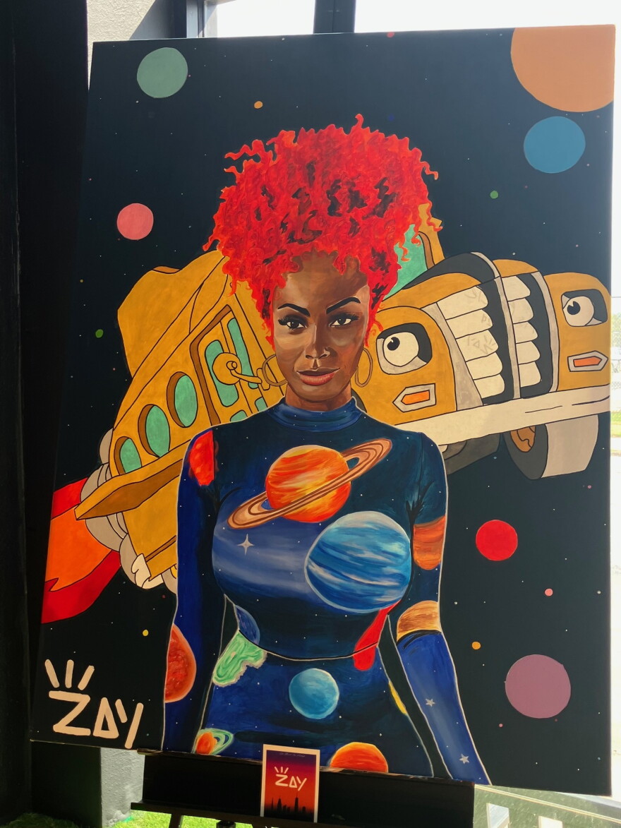 One of Willliams's paintings inside Celebrity's Beauty Supply, 1600 Harrison St., Davenport.