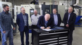 Gov. Gianforte signs Senate Bills 159 and 399 into law May 6, 2021 besides (L to R) Steven Thompson, Sen. Greg Hertz (R-Polson), Ray Thompson, Senate President Mark Blasdel (R-Kalispell), and Director of Commerce Scott Ostermann.