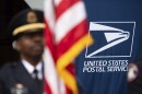 A U.S. Postal Service police honor guard member stands at attention during the service's 250th anniversary ceremony, Wednesday, July 23, 2025, in Washington. (AP Photo/Cliff Owen)