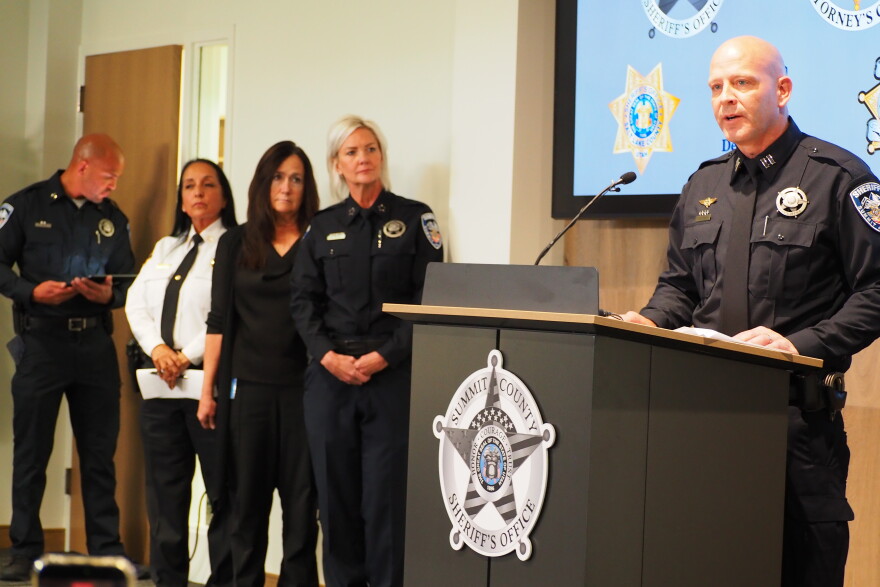 Summit County sheriff's Capt. Justin Hemingway speaks at an Oct. 27, 2026, press conference confirming Ted Bundy as the murderer of Melissa Anne Smith, 17, who died in 1974. Behind him stand (right to left) Summit County Sheriff Kacey Bates,