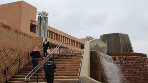 UT-Arlington students walk around campus on Oct. 25, 2023.