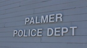 A wall with the name "Palmer Police Dept."