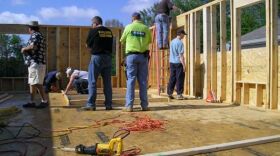 Volunteers put up the walls of a Calloway County Habitat home.