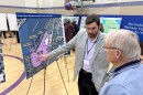 Mark Kolonoski of HNTB explains the relocated Bourne Recreation Area to a visitor at Tuesday's open house, hosted by the Massachusetts Department of Transportation, regarding the Cape Cod bridges reconstruction project.