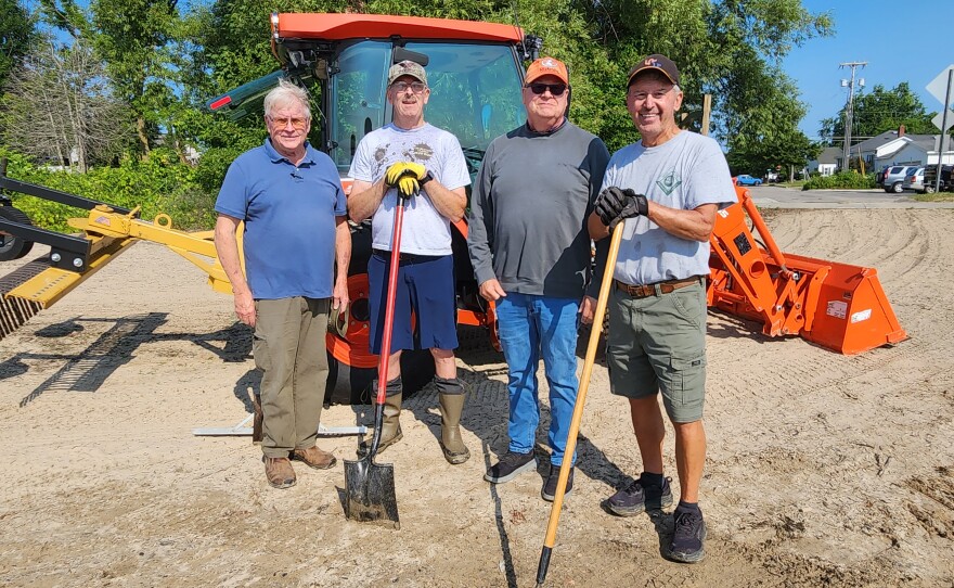 MIShores founder Jeff Welch (left) stands with Dave Szydlowski, Jeff Johnston and Dennis Werblow (right) during a beach clean up at Blair Street Pier in Alpena, Michigan on Friday, July 24, 2026.