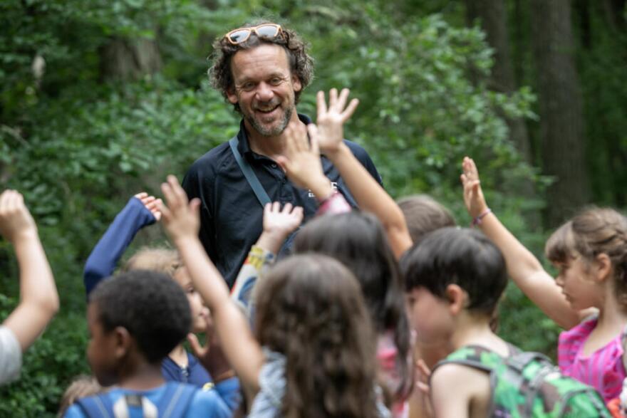 Hale Day Camp Executive Director Aaron Morehouse talks with a group of campers.  (Robin Lubbock/WBUR)