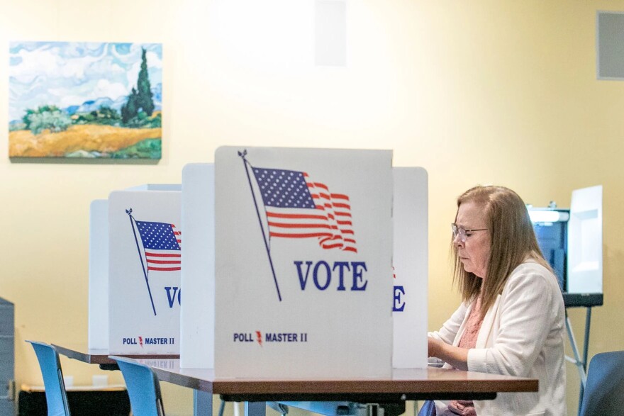 Rose Douglas fills out her ballot at Precinct 7 at the Traverse Area District Library Main Branch on Tuesday in Traverse City.