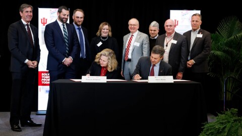 Indiana University President Pamela S. Whitten and Eli Lilly and Company Chair and CEO David Ricks sign an agreement during an event at IU Indianapolis on Wednesday, Dec. 3, 2025.