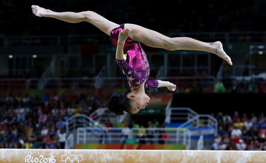 China's Shang Chunsong competes in the beam event during the women's team final.