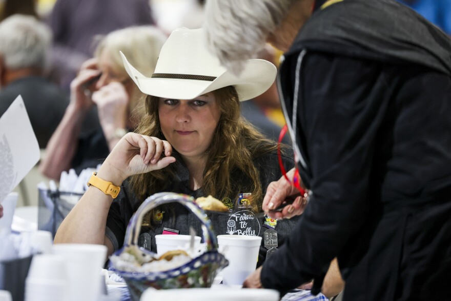 Mallorey Atkins waits for a piece of fried pie for judging at the State Fair of Texas food competition Monday, Sept. 29, 2025, in Dallas.