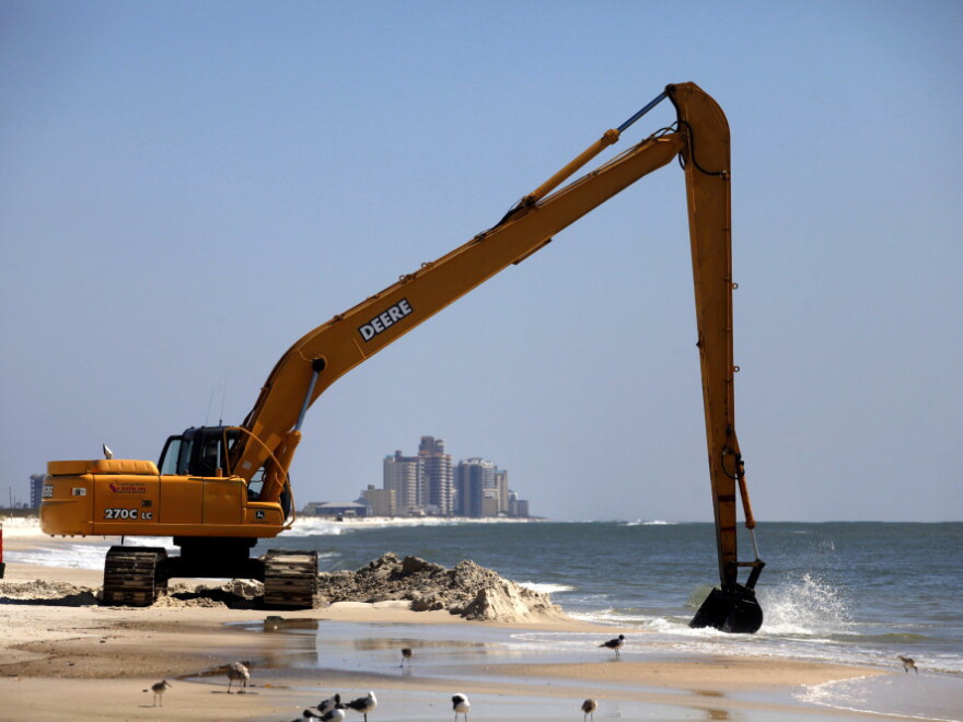 Workers clean oil leftover from the Deepwater Horizon oil spill in the Gulf of Mexico in Pensacola, Florida last month. Wednesday marks the one-year anniversary of the BP oil spill.