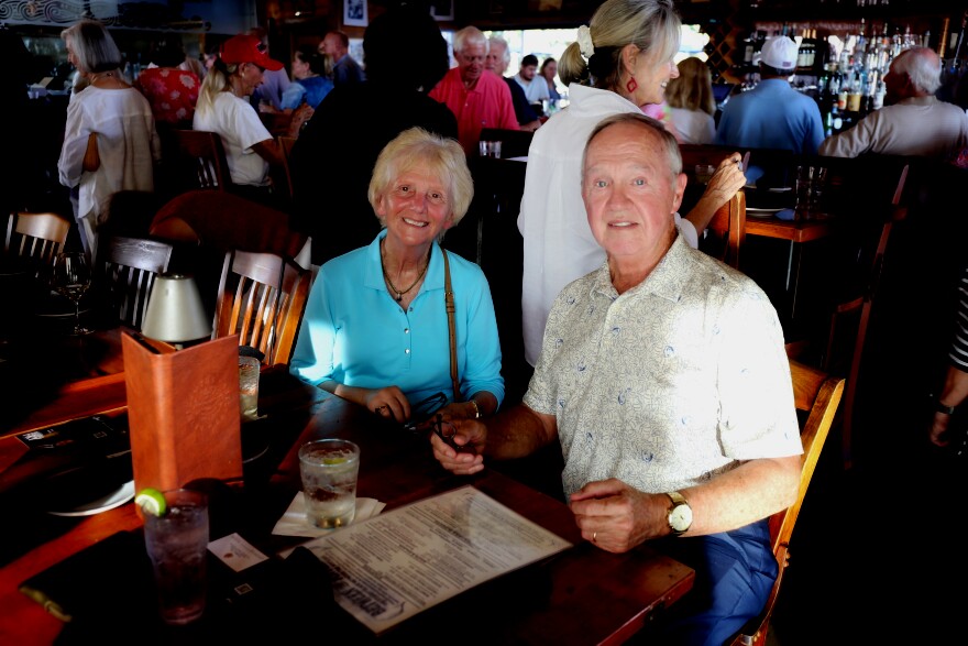 Betty (left) and John West (right) attend a gathering for Republican Congressman Russell Fry in Georgetown. The retired couple recently moved to Pawleys Island because they felt their Atlanta suburb was becoming too liberal.