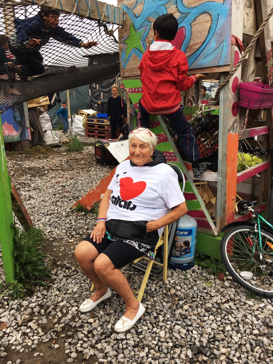 Wearing an "I Heart Calais" T-shirt, Nicole Cordier visits a part of The Jungle where children can play. Some at the camp ask how she got a small cut on her knee. "No one in Calais ever asked me about that," she says.