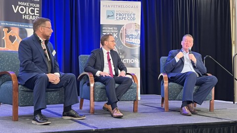 Panelists speak during the Housing to Protect Cape Cod summit, Oct. 17, 2024. From left: Paul Niedzwiecki, CEO of the Cape Cod Chamber of Commerce; Eric Shupin, chief of policy, Executive Office of Housing & Livable Communities; and Edward Augustus, Massachusetts secretary of housing and livable communities.