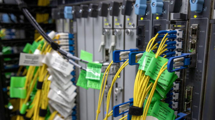 Cables connect to servers at Equinix’s data center in Billerica, Mass.  (Robin Lubbock/WBUR)