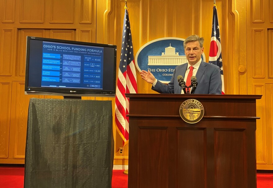 Ohio Senate Finance Committee chair Matt Dolan (R-Chagrin Falls) explains a chart showing the Senate budget's formula for calculating per-student aid.