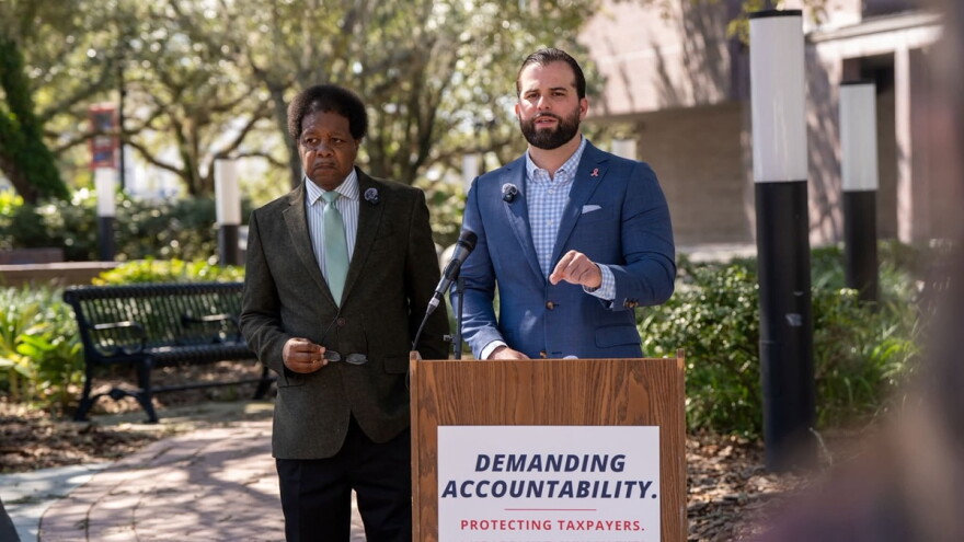 Leon County Commissioners Bill Proctor (left) and Christian Caban announce the findings of a review of the local fire services fee