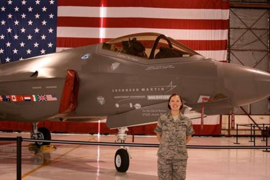 Air Force veteran Katherine Pratt in front of an F-35 Joint Strike Fighter. Pratt's detachment was responsible for the operational tests.