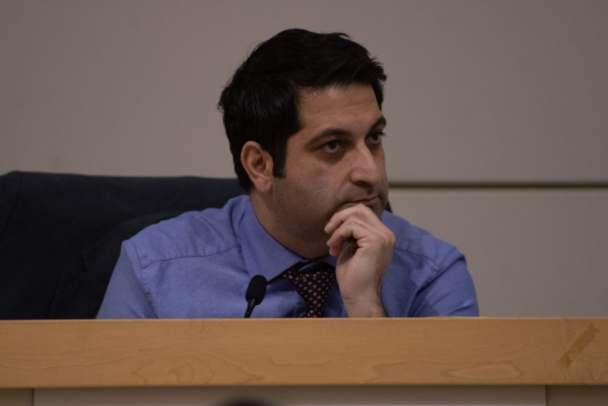 Fresno City Council President Mike Karbassi listens to a colleague during the Jan. 30 Fresno City Council meeting. He co-sponsored a new city ordinance that would penalize cities and neighboring jurisdictions for transporting unhoused people to Fresno and dropping them off within city limits.