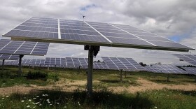 Solar trackers installed in South Burlington in a field on a cloudy day are pictured in this July 27, 2011