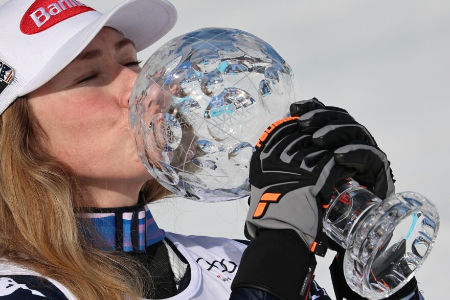United States' Mikaela Shiffrin kisses the globe trophy for the alpine ski, women's slalom discipline, at the Lillehammer World Cup Finals, in Hafjell, Norway, Tuesday, March 24, 2026.