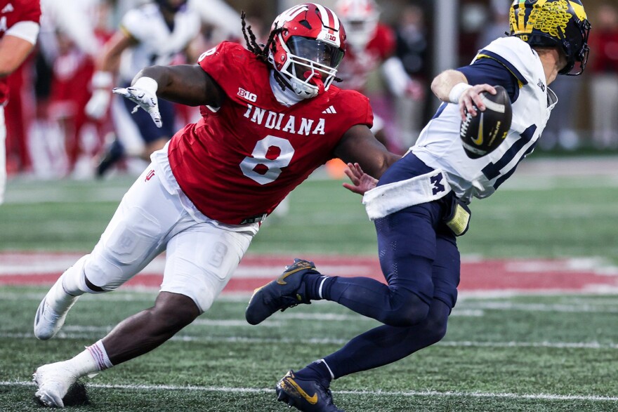 Indiana's CJ West chases after Michigan quarterback Davis Warren during a Nov. 9 game at Memorial Stadium.
